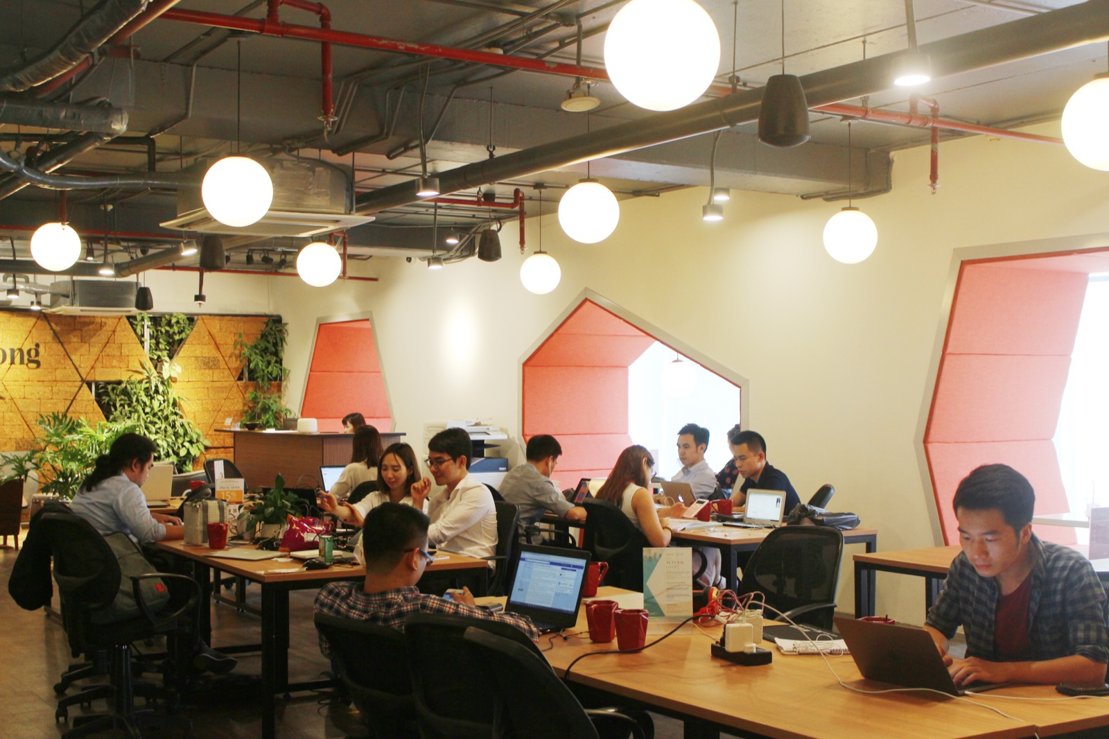 A busy, welcoming coworking floor